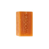 Woody's For Men Hair & Body Shampoo Bar Unwrapped revealing a translucent amber soap bar with moisturizing ingredients.